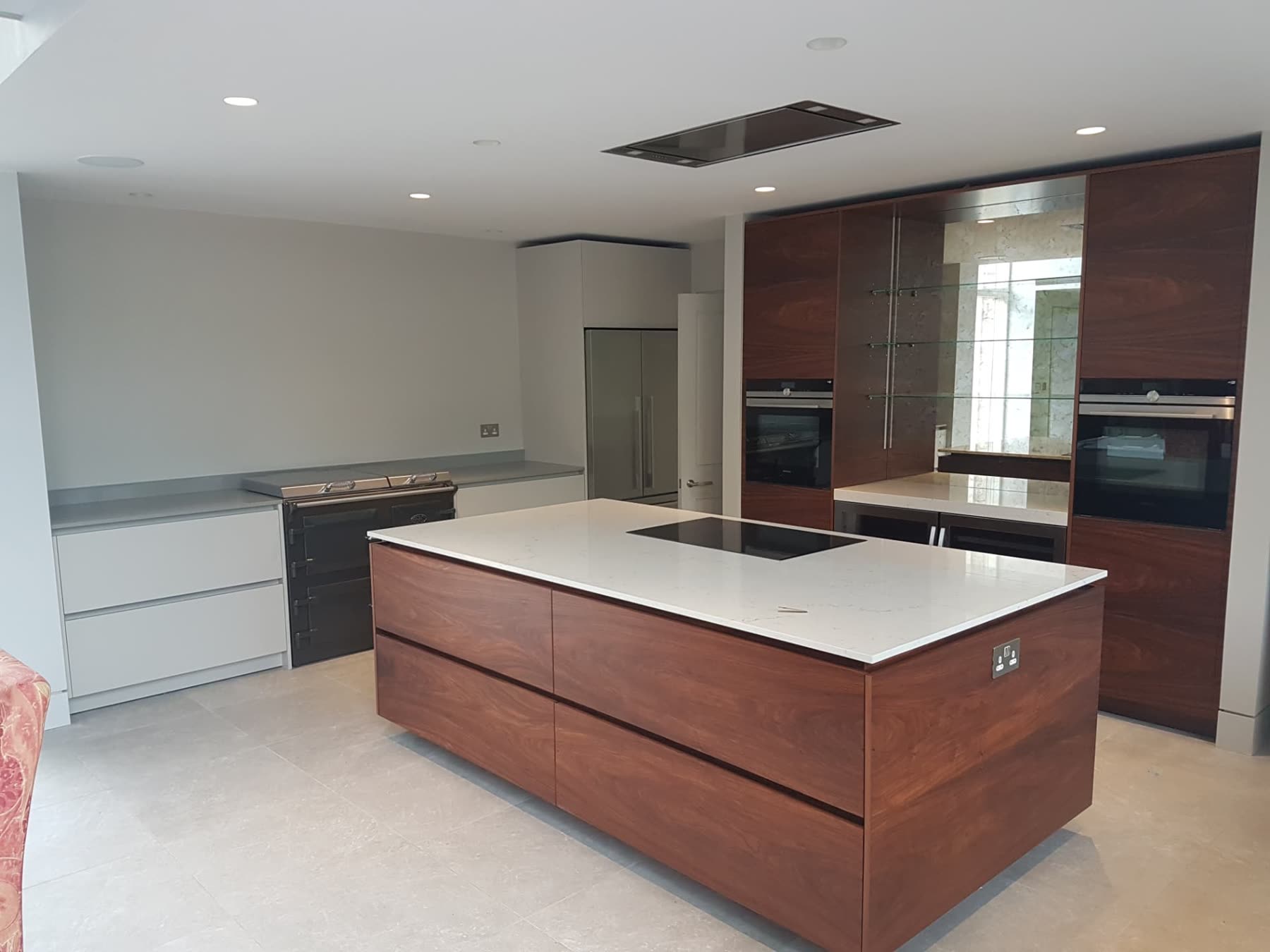 Contemporary kitchen with dark timber island, quartz worktop and built-in ovens