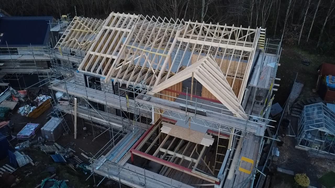 Development under construction with groundworks complete and structures rising
