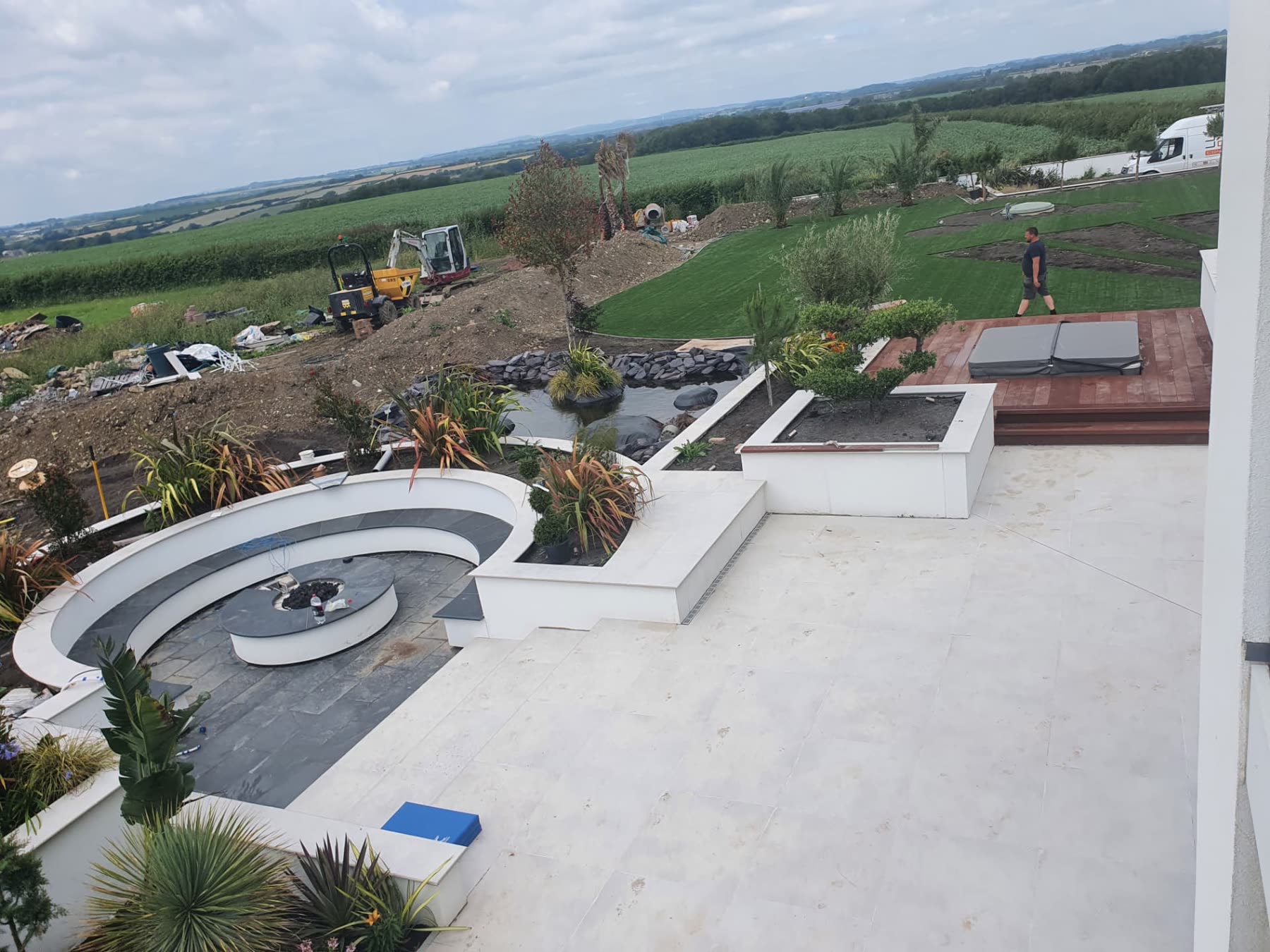 Aerial view of the completed Rhoose garden with pond, fire pit seating and new lawns